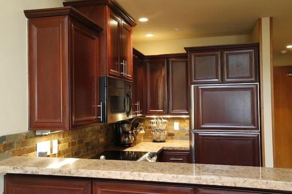 Stunning designer kitchen comes fully equipped including 10 sets of dishes.